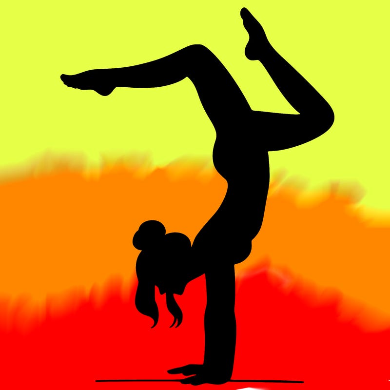 a woman doing a handstand