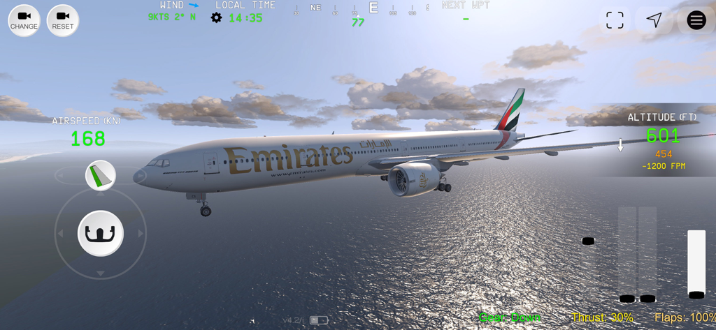 Flight Simulator Advanced - An Emirates Boeing 777 airplane flying low over the ocean with landing gear down in Flight Simulator Advanced
