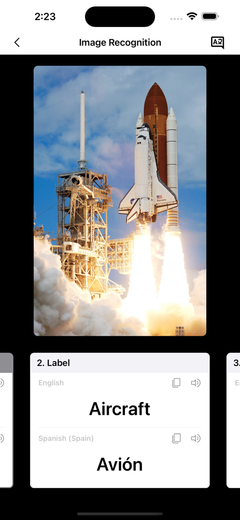 スペースシャトル打ち上げの画像認識とスペイン語翻訳を表示するインスタントボイス翻訳アプリ画面