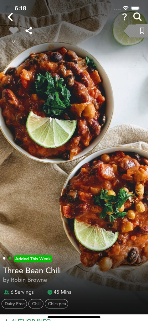 Vegan three bean chili recipe screen with lime and kale garnish