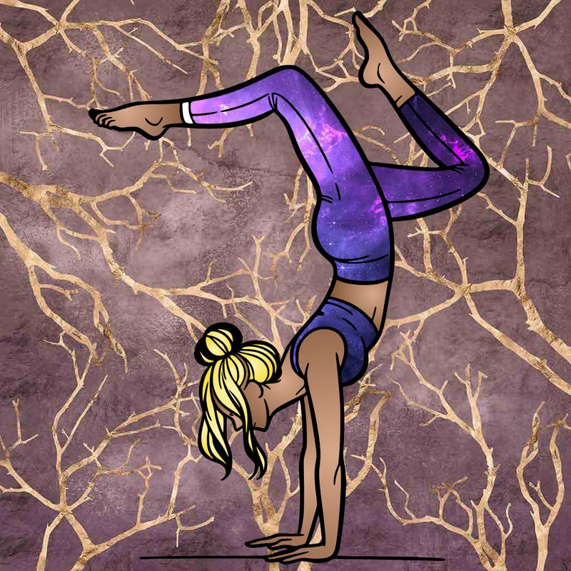 a woman doing a handstand