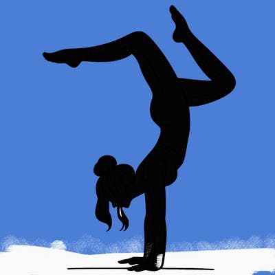 a woman doing a handstand