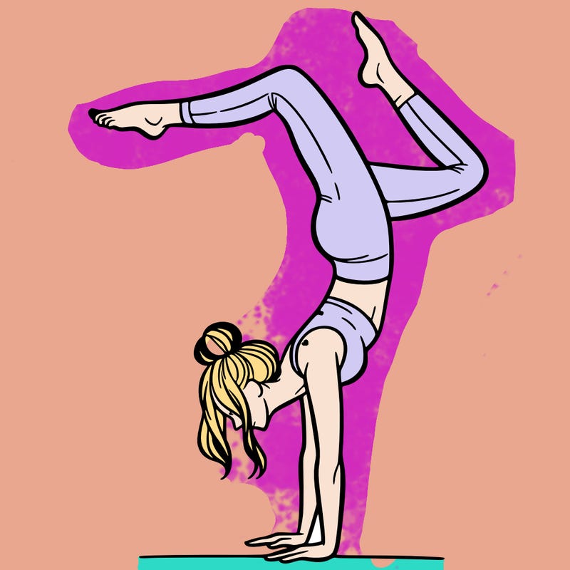 a woman doing a handstand
