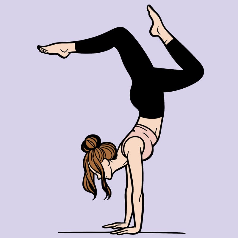 a woman doing a handstand