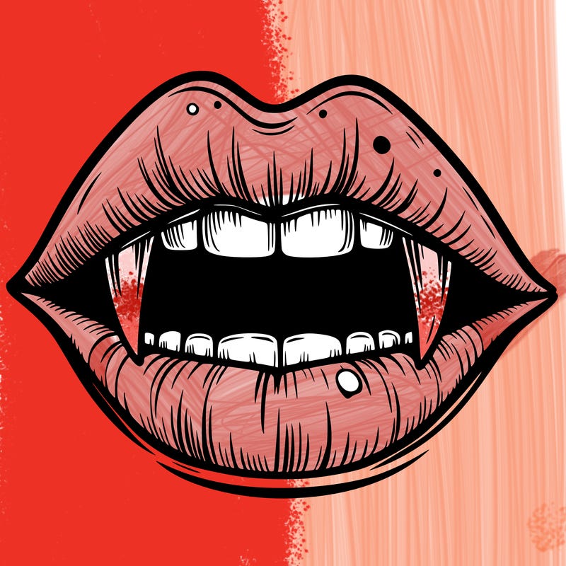 lips with vampire teeth