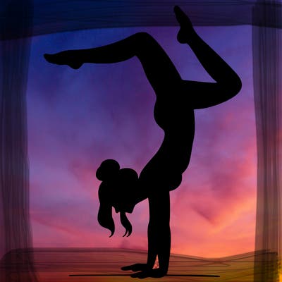 a woman doing a handstand