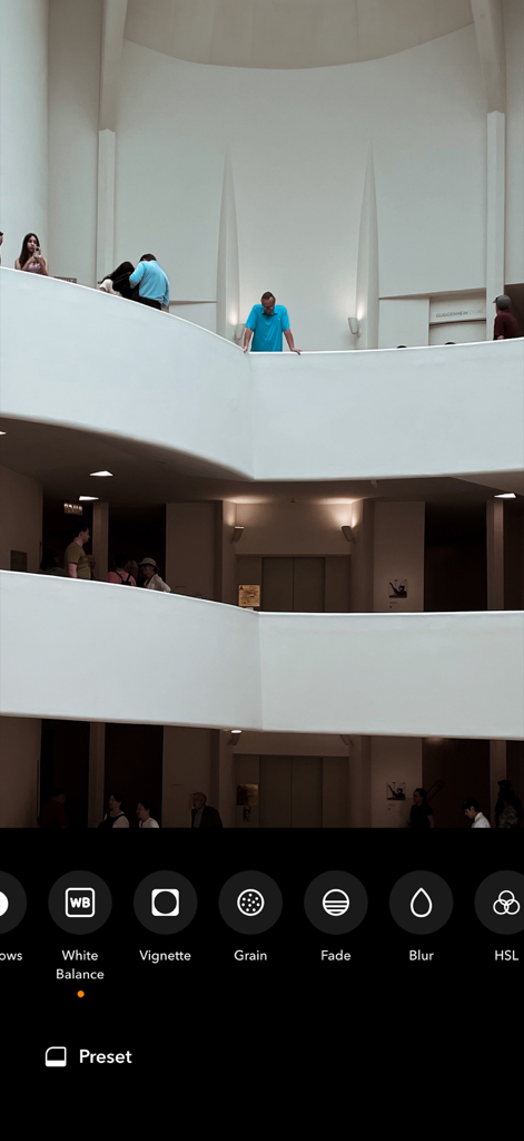 Retrica: Vintage Camera Studio - Retrica app interface showing photo editing tools like white balance, vignette, and grain on a museum interior photo.