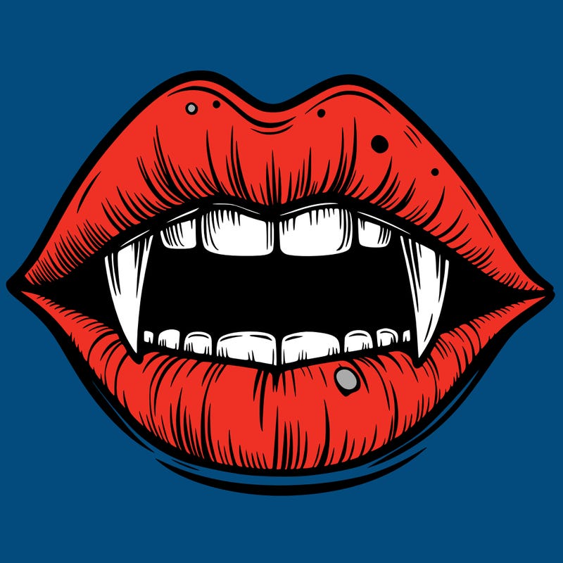 lips with vampire teeth