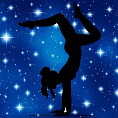 a woman doing a handstand