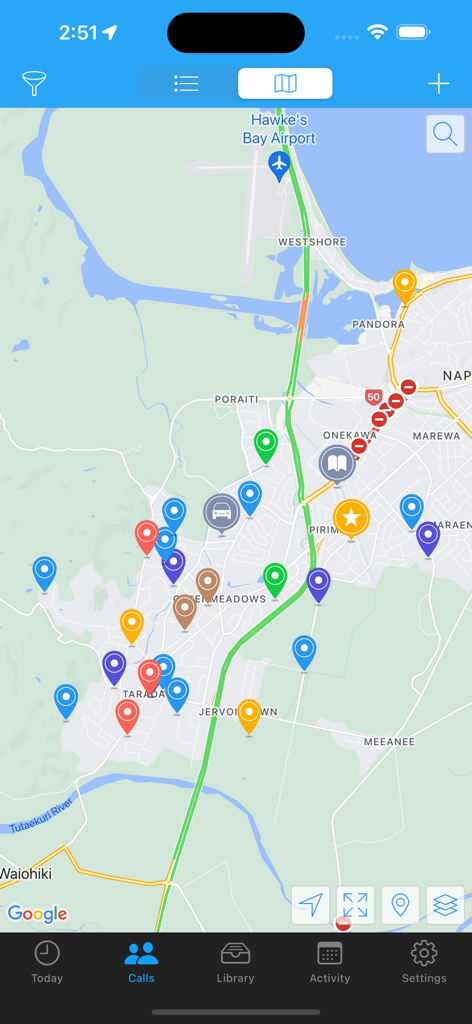 ServicePlanner - A map interface within the ServicePlanner app showing colored pin markers for ministry contacts and territory locations