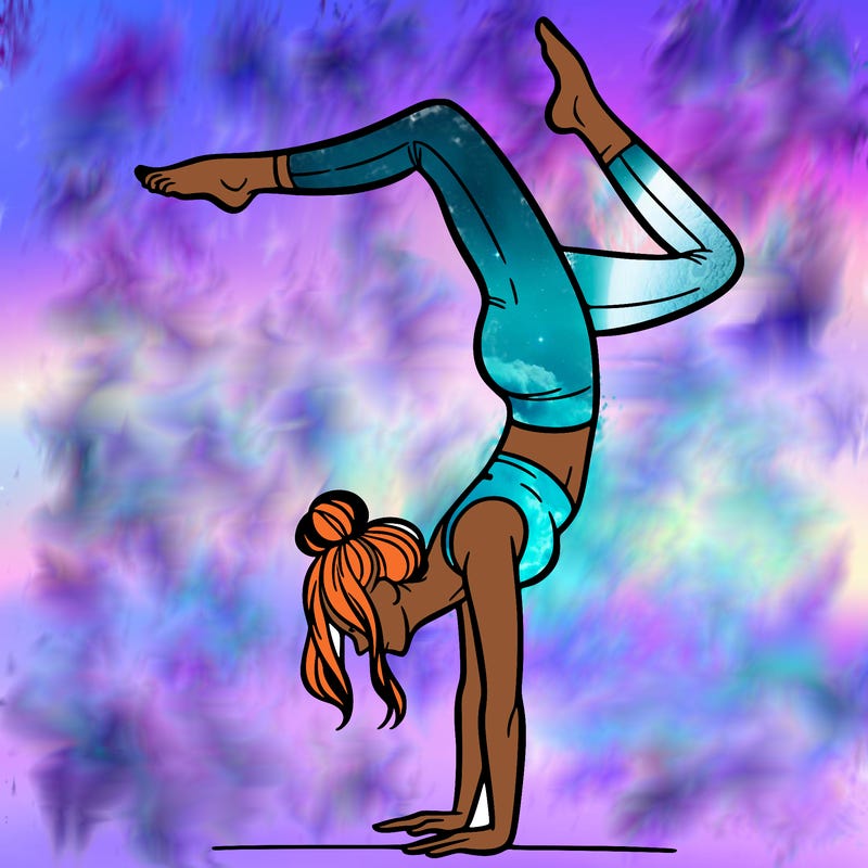 a woman doing a handstand