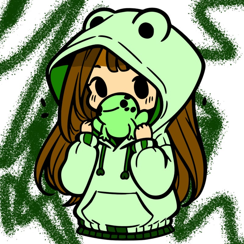 a girl holding a froggy hoodie