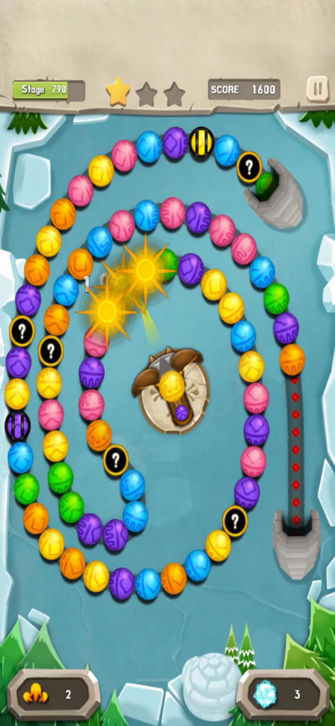 Marble Mission gameplay showing colored marbles on an icy spiral track