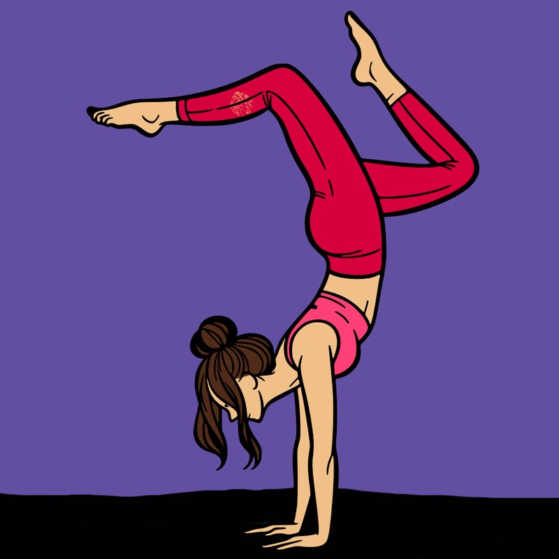 a woman doing a handstand