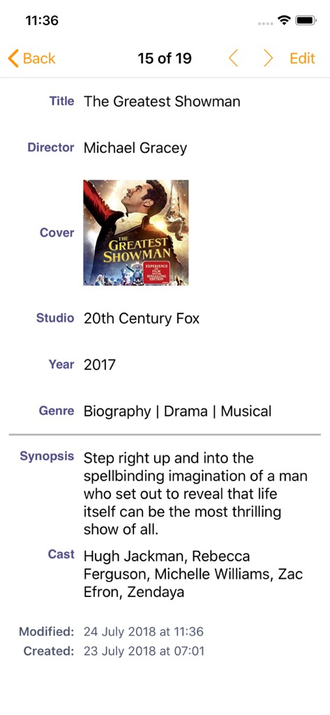 iDatabase - A detailed view of a movie entry in the iDatabase app showing fields for title director cover art and synopsis for The Greatest Showman