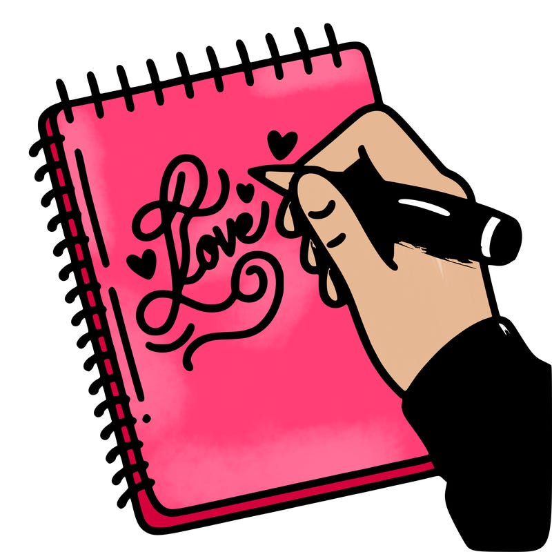 a hand writing “love” in calligraphy on a notebook