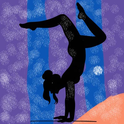 a woman doing a handstand