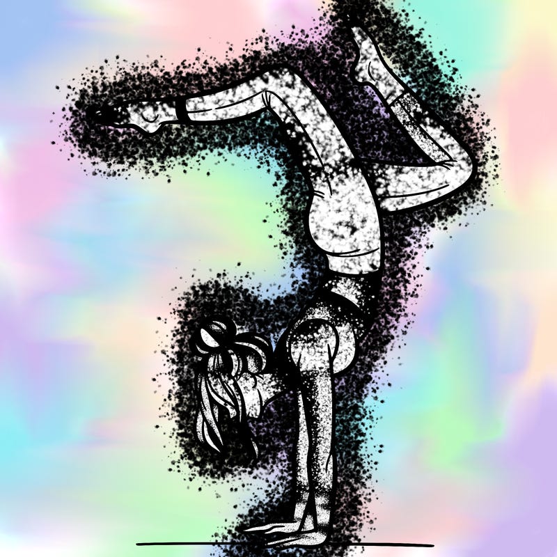 a woman doing a handstand