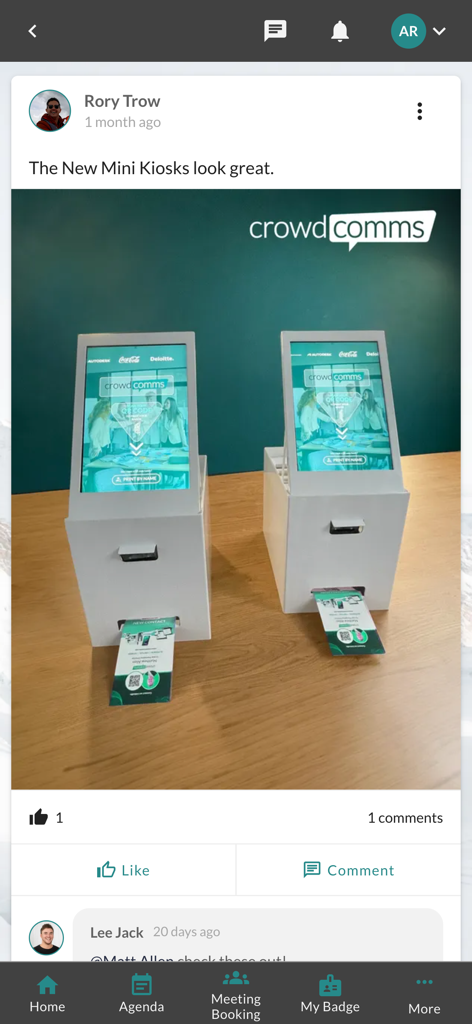 CrowdComms - Social feed post in the CrowdComms app showing two white digital mini kiosks for event check-in and badge printing