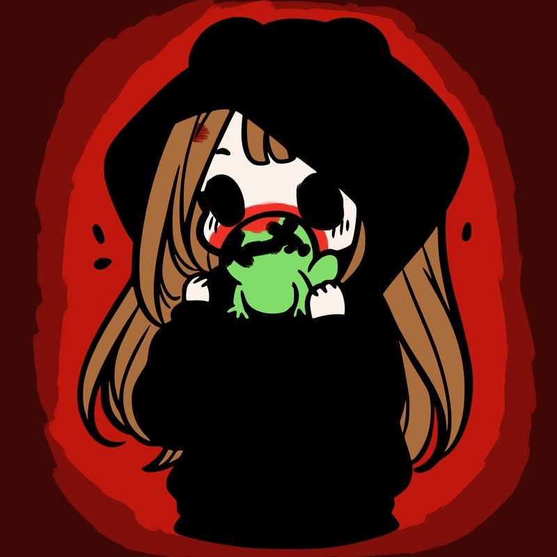 a girl holding a froggy hoodie