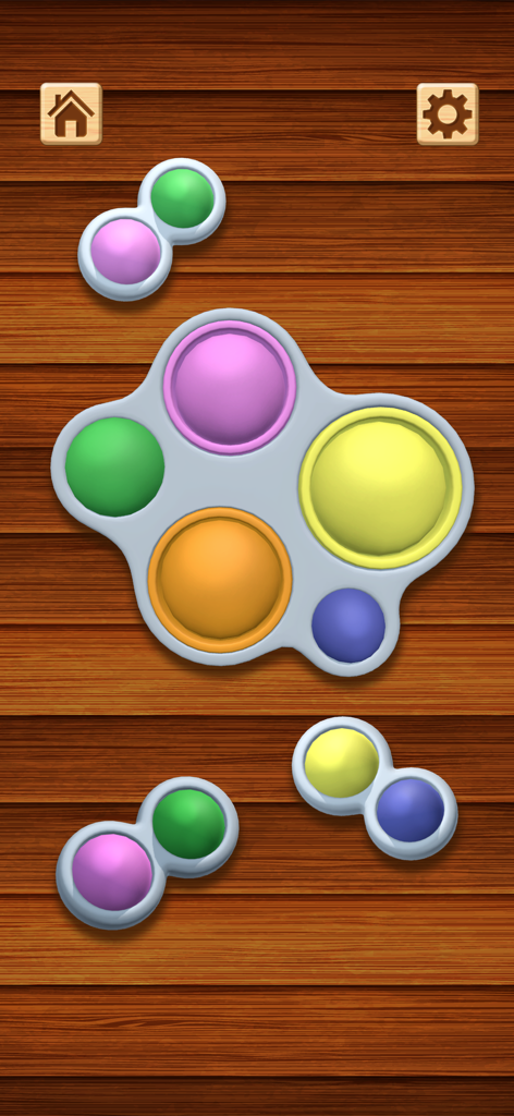 Colorful 3D pop it fidget toys on a wooden texture background