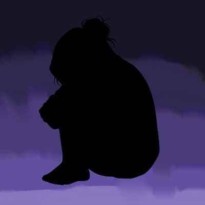 girl crying with hoodie over her hair and hair in bun