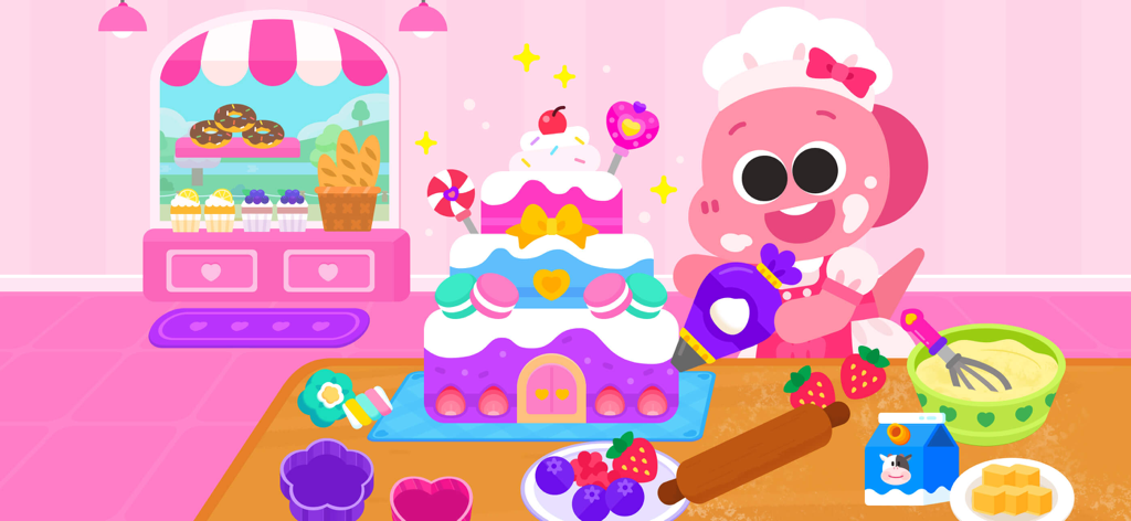 Cocobi Little Kitchen - kids - Un chef dinosaurio rosa decorando un pastel grande de varios niveles en una cocina colorida