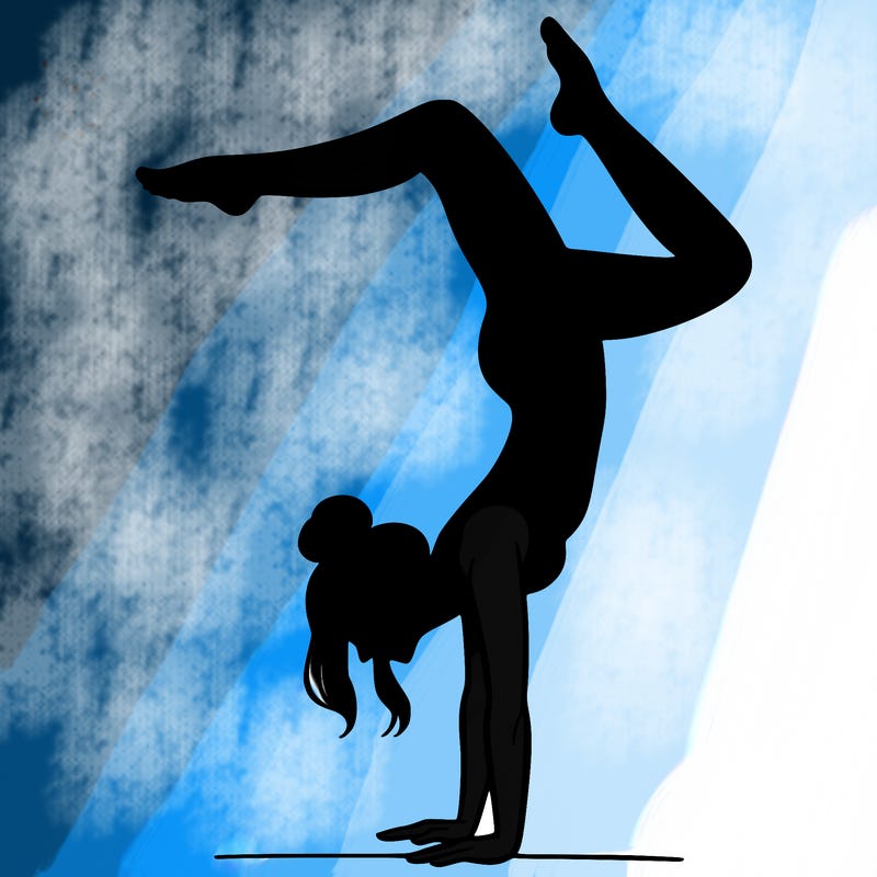 a woman doing a handstand