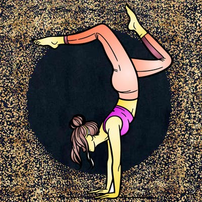 a woman doing a handstand