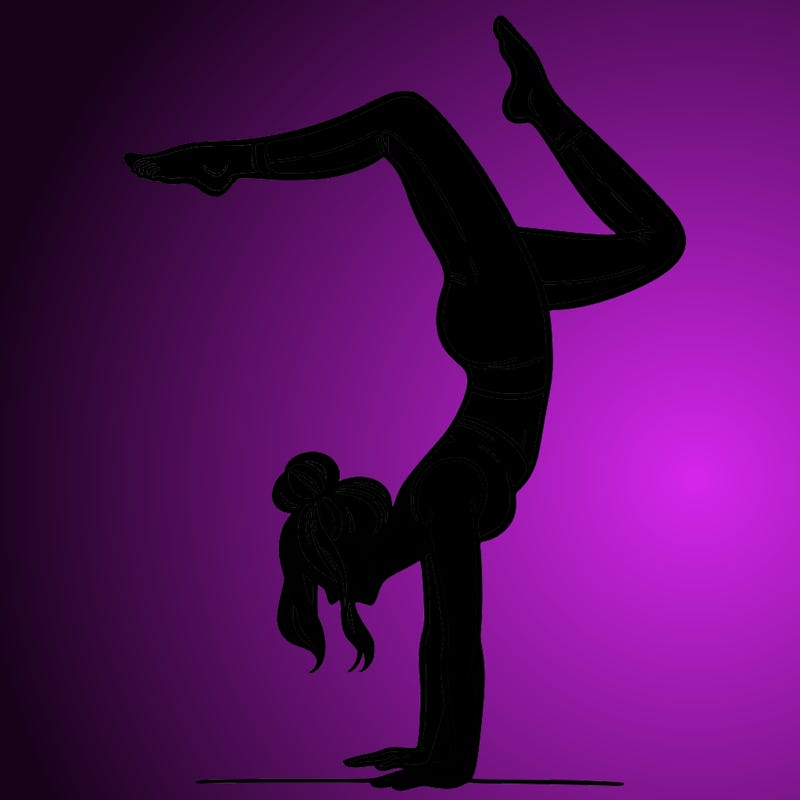 a woman doing a handstand