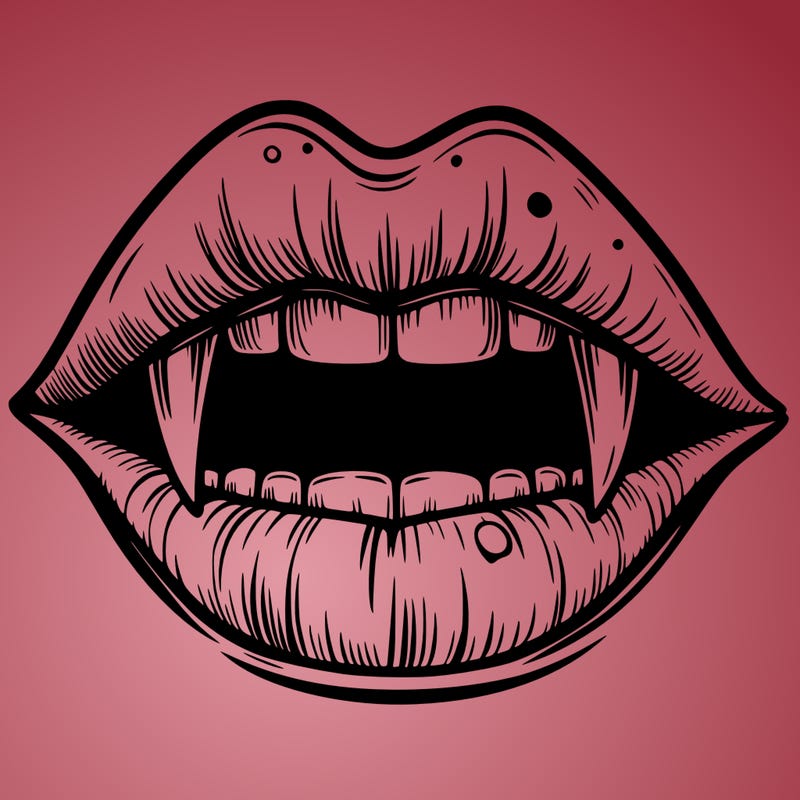 lips with vampire teeth