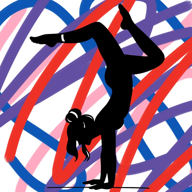 a woman doing a handstand