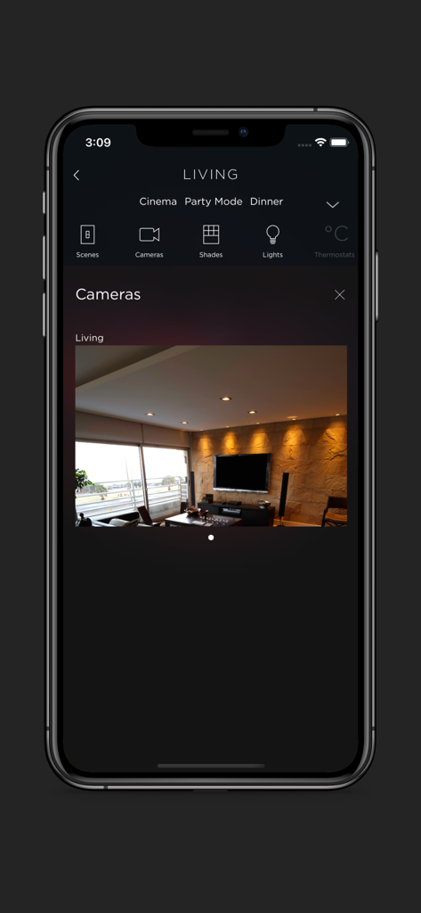 BeoLiving - BeoLiving app showing a live camera feed of a luxury living room with premium audio equipment