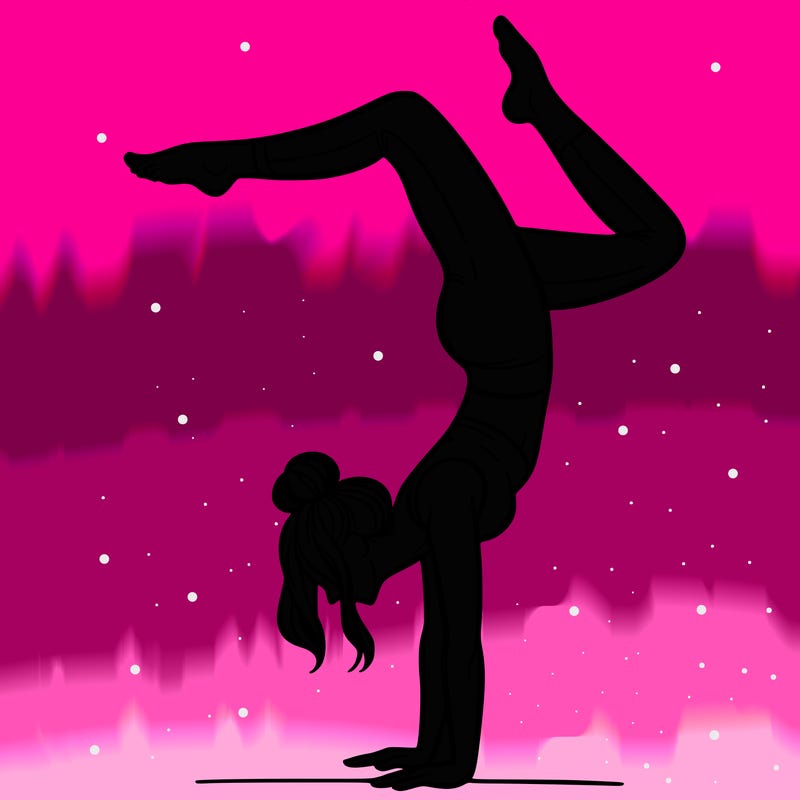 a woman doing a handstand