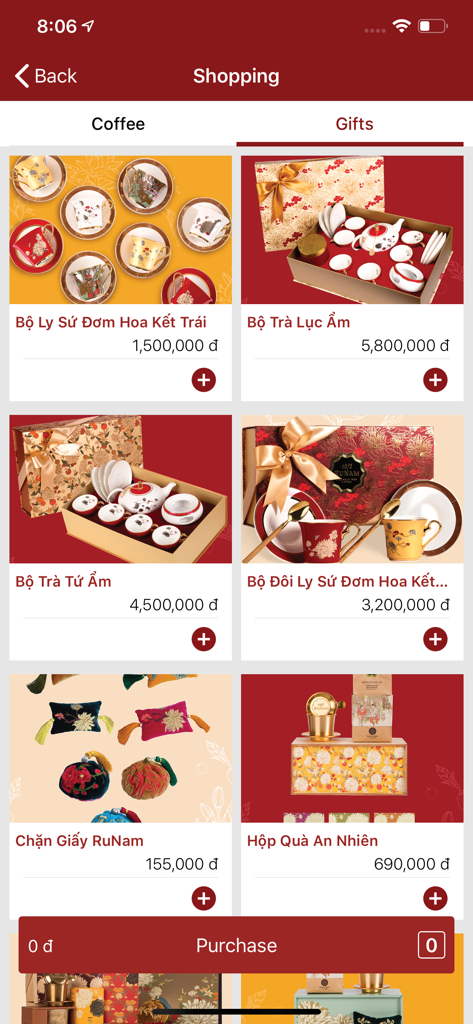 Saigon Taste - The shopping screen of the Saigon Taste app showing various Vietnamese gift sets like ceramic tea and coffee cups.