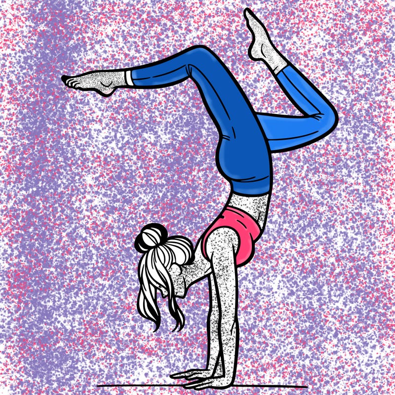 a woman doing a handstand
