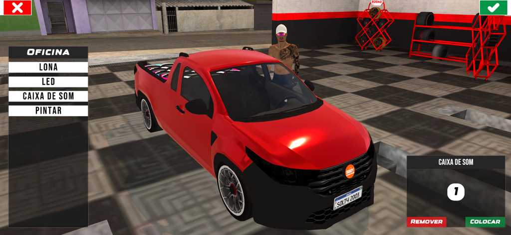 Una camioneta roja siendo personalizada en un garaje con opciones de ajuste