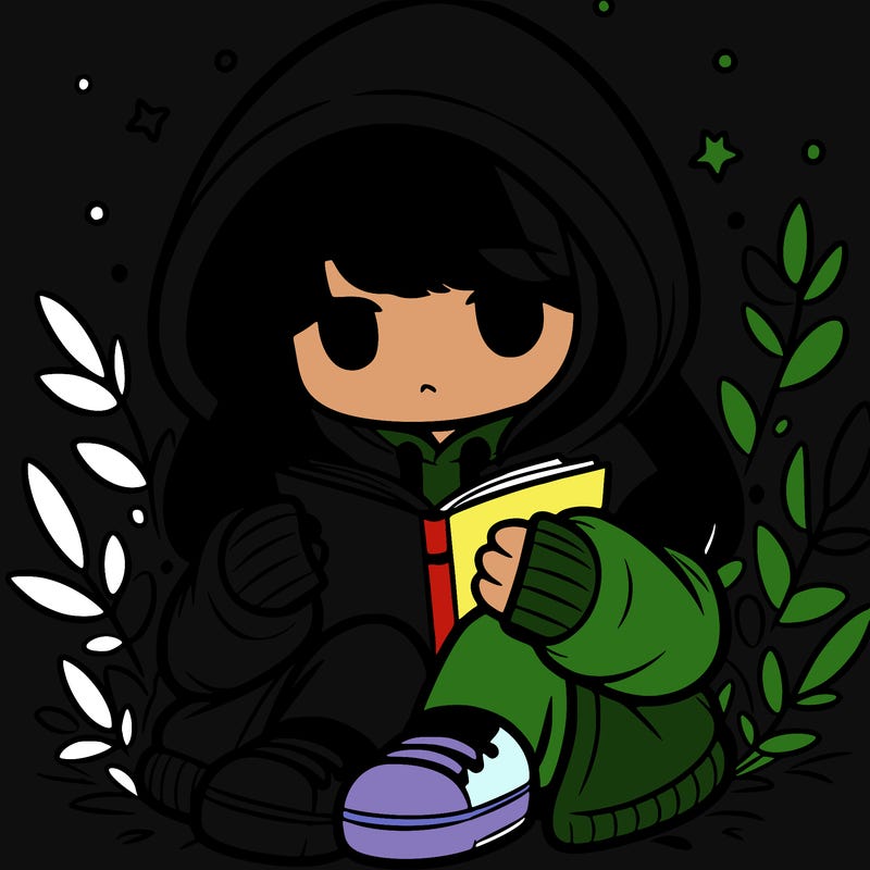 girl in oversized hoodie reading a book