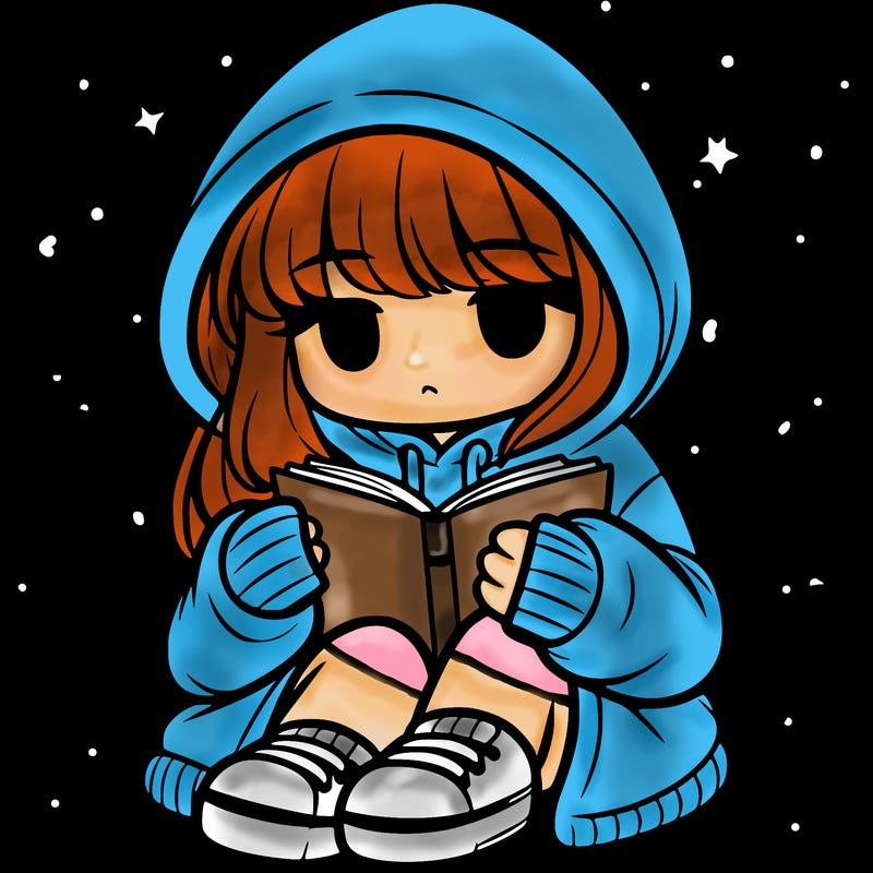 girl in oversized hoodie reading a book