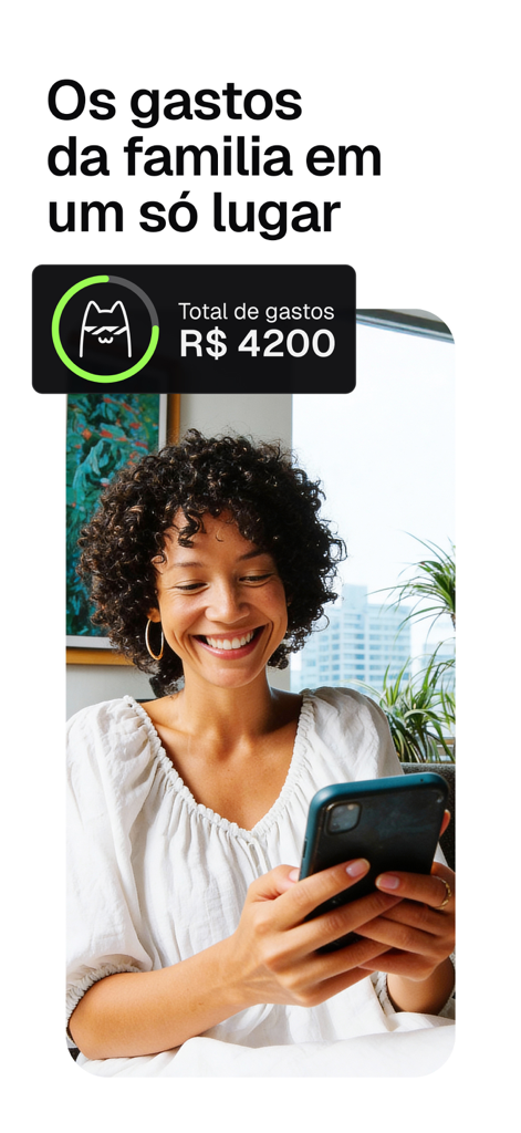 A woman smiling while tracking family expenses on her phone using the Pierre app