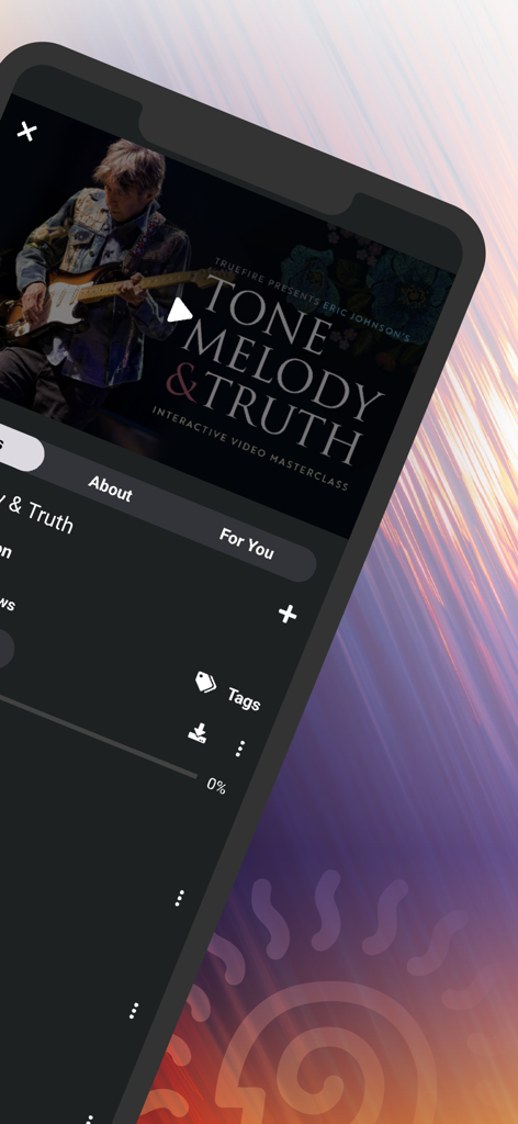 Captura de pantalla de la aplicación TrueFire que muestra una clase magistral de vídeo interactiva de guitarra titulada "Tone Melody and Truth".