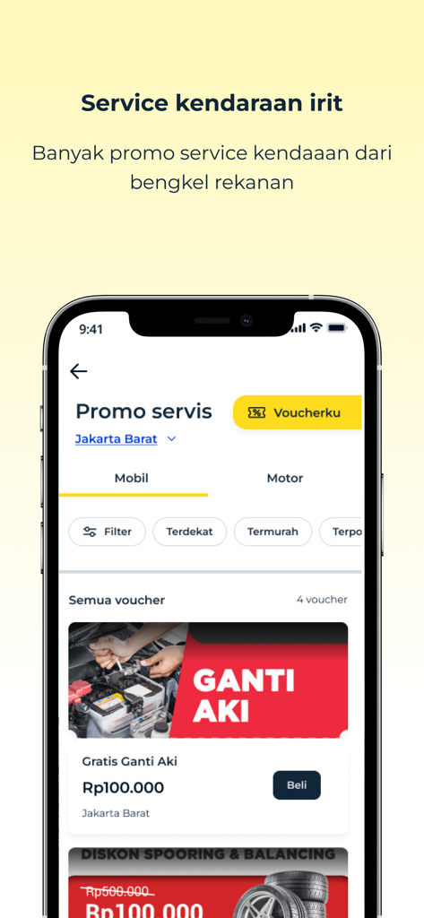 A screenshot of the Adiraku app showing car and motorcycle service promotions including battery replacement and wheel alignment vouchers.