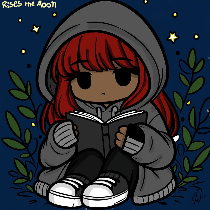 girl in oversized hoodie reading a book