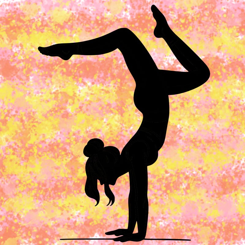 a woman doing a handstand