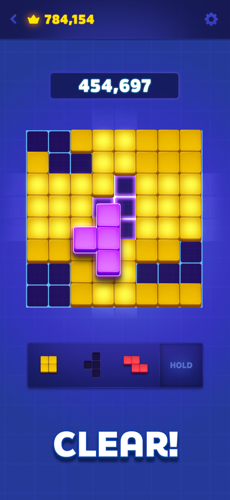Tetris® Block Blast - テトリスブロックブラストのゲームプレイ画面。ブロックパズルグリッドに黄色と紫のピースとクリアメッセージが表示されている。