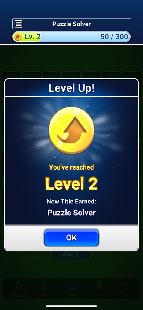 Level up notification in Addiction Solitaire showing Level 2 reached and Puzzle Solver title earned