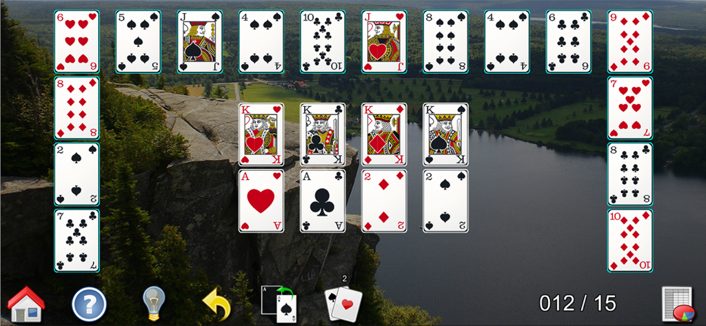 Gameplay of All-in-One Solitaire Pro featuring large playing cards over a scenic nature background