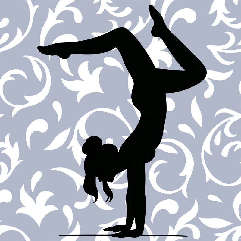 a woman doing a handstand