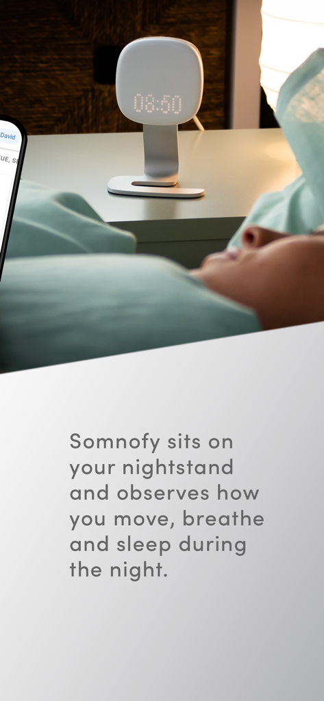 Somnofy - Somnofy sleep assistant device on a nightstand monitoring a sleeping person.