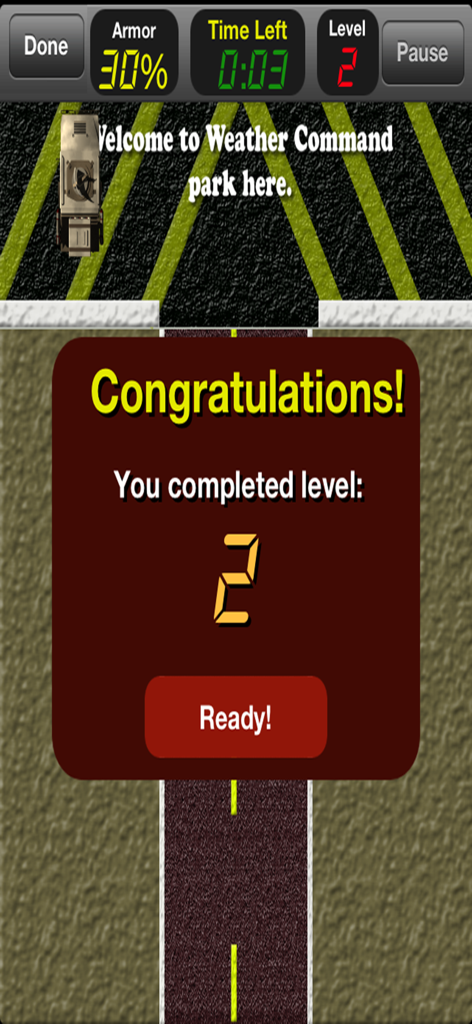 Tornado Alley Attack - Level 2 completion screen in Tornado Alley Attack mobile game showing a victory message and the storm chaser vehicle parked at weather command